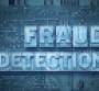 fraud detection phrase made from metallic letterpress blocks on the pc board background