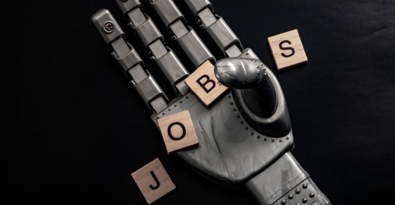tiles spelling "jobs" being held by a robot