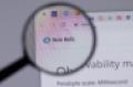 New Relic website being looked at through a magnifying glass