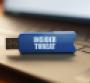 On the laptop keyboard is a flash drive with the inscription - INSIDER THREAT