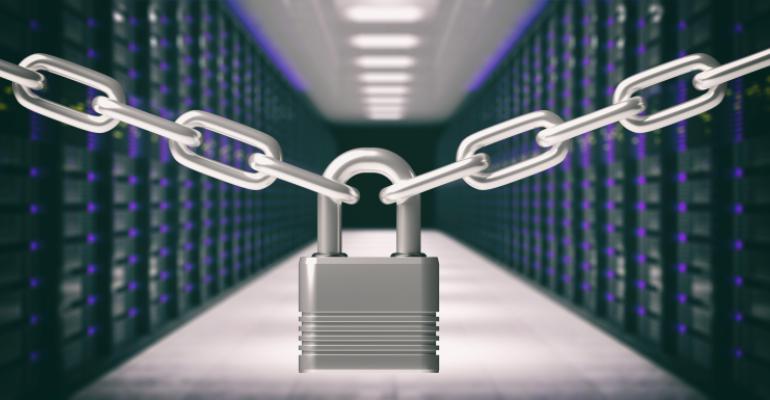 Padlock locked and chains against data center background